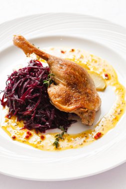 Roast duck with beetroot on plate