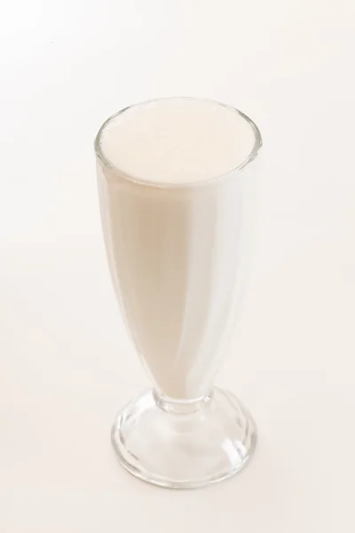 Milk cocktail in glass on white — Stock Photo, Image