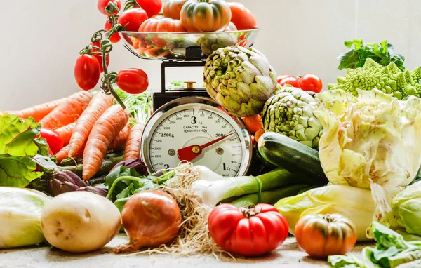 Fresh vegetables on scales — Stock Photo, Image