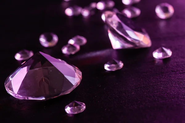 Different diamonds on background — Stock Photo, Image