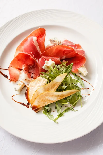 Salad with ham on plate — Stock Photo, Image