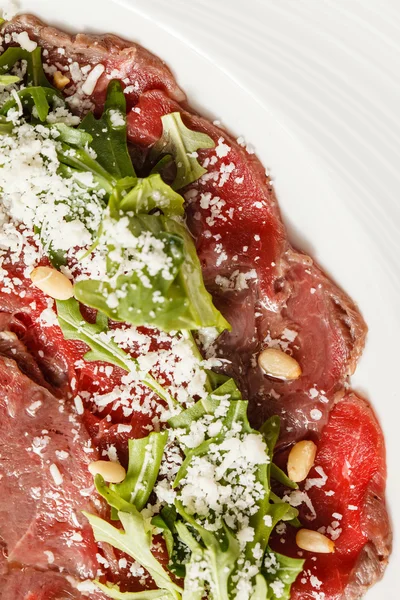 Meat carpaccio with rucola — Stock Photo, Image