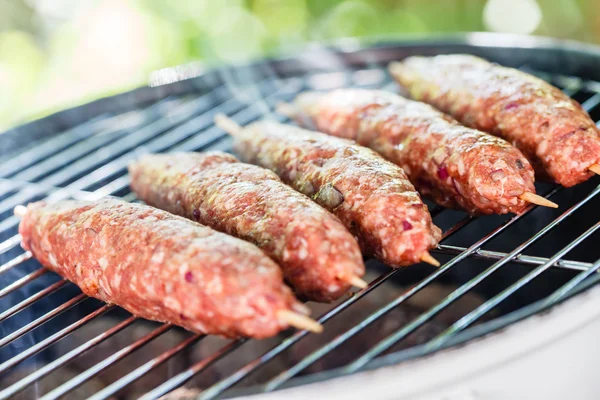 Grilling kebabs on grill — Stock Photo, Image