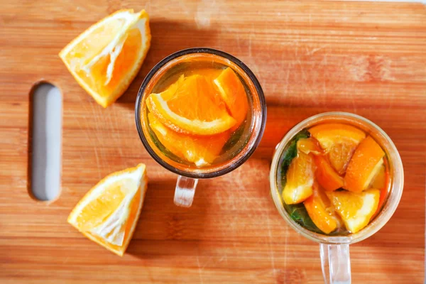Tasty orange tea with mint — Stock Photo, Image