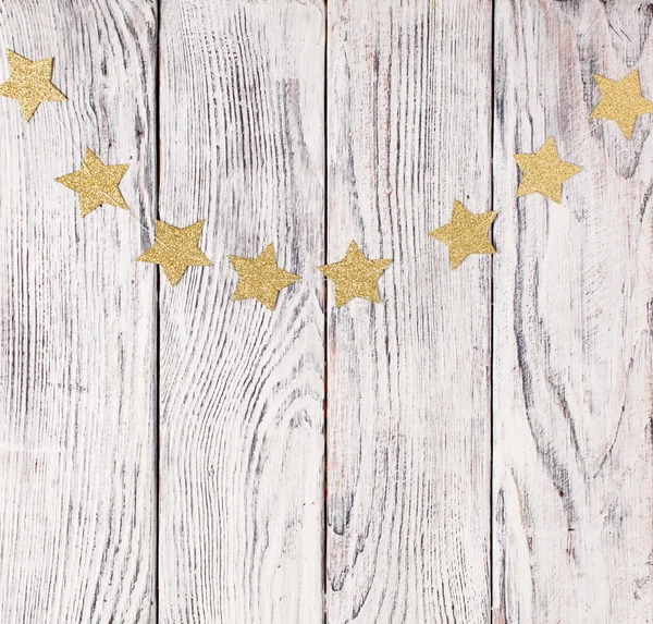 Estrellas de Navidad sobre fondo de madera — Foto de Stock