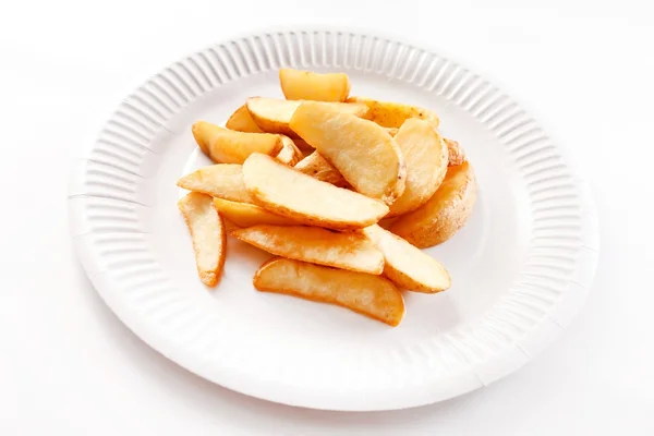 Fried potatoes on paper plate — Stock Photo, Image