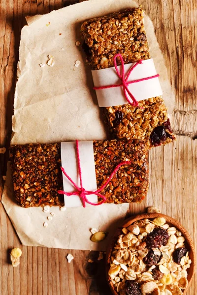 Granola bars on white paper — Stock Photo, Image