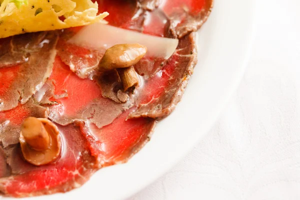 Meat carpaccio with mashrooms — Stock Photo, Image