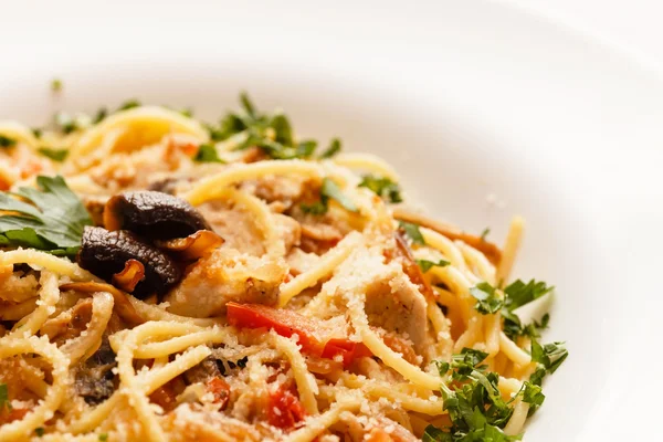 Pasta with meat and mushrooms — Stock Photo, Image