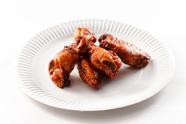 Fried chicken on paper plate — Stock Photo, Image