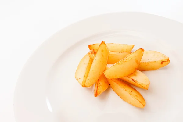 Roasted potatoes on plate — Stock Photo, Image