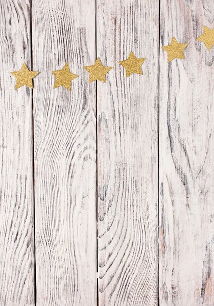 Estrellas de Navidad sobre fondo de madera — Foto de Stock