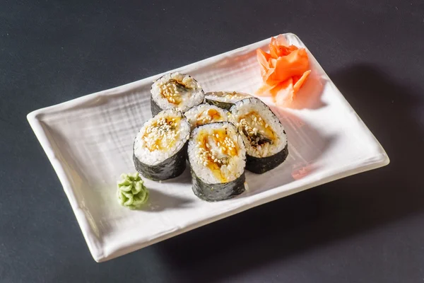 Tasty sushi rolls on plate — Stock Photo, Image