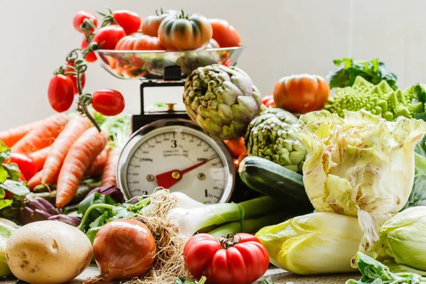 Fresh vegetables on scales — Stock Photo, Image