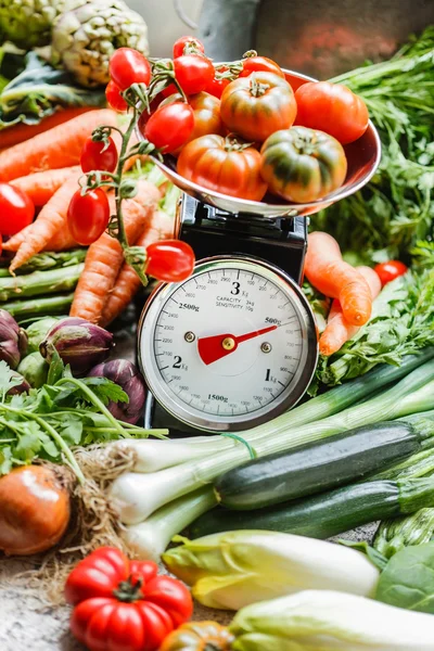 Fresh vegetables on scales — Stock Photo, Image