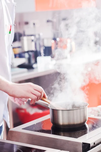 Chef cooking  at work — Stock Photo, Image