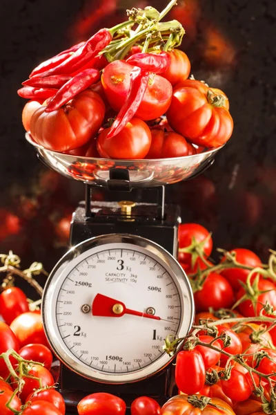 Ripe red tomatoes on scales — Stock Photo, Image