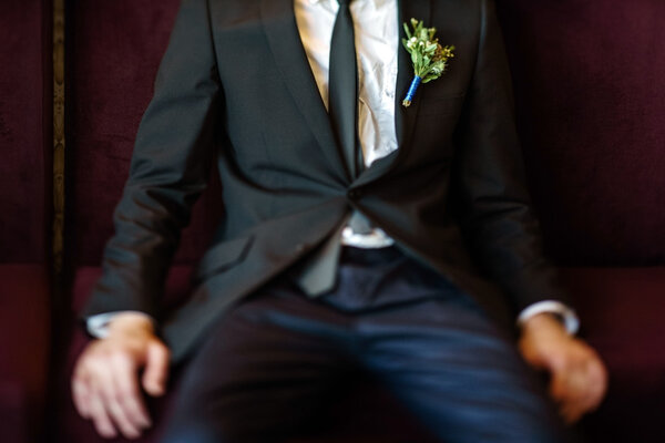 Elegant groom with flowers