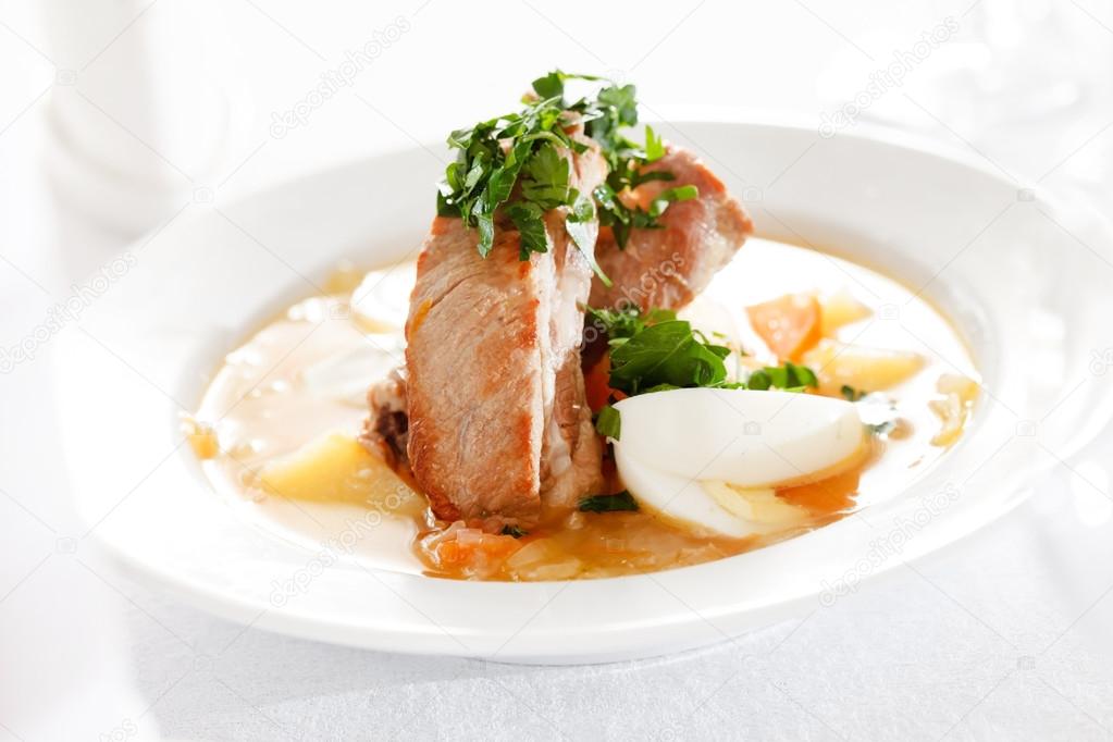 soup with meat in plate