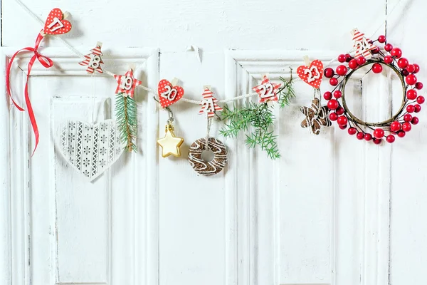 Christmas garland decoration on door — Stock Photo, Image