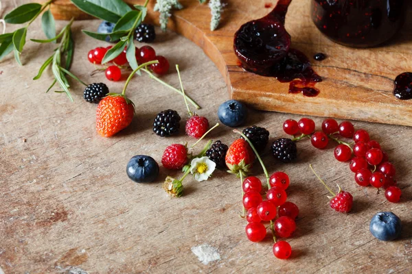 Berries jam in spoon with berries