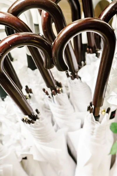 White umbrellas with handles — Stock Photo, Image