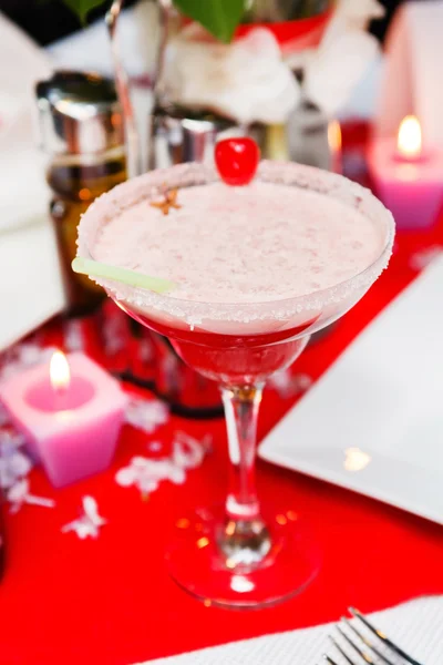 Cocktail with cherry on table — Stock Photo, Image