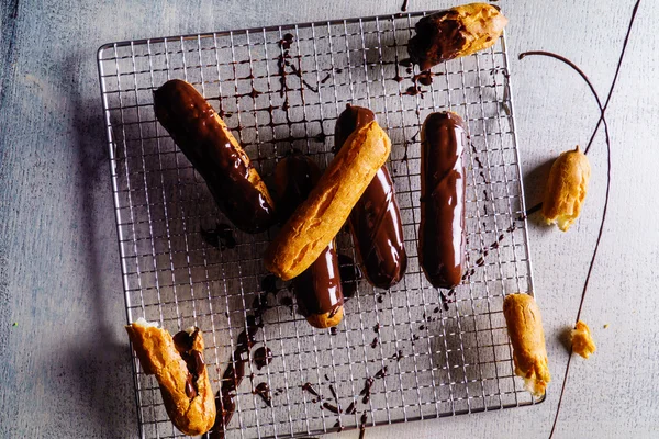 Tasty chocolate eclairs — Stock Photo, Image