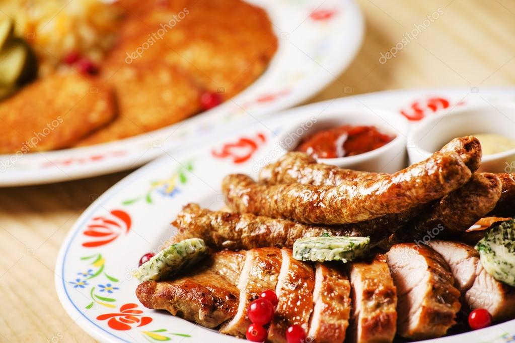 Mixed meat plate and potato pancakes