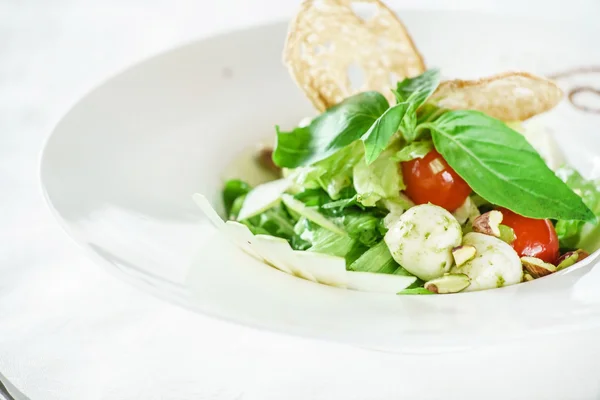 Tasty salad on plate — Stock Photo, Image