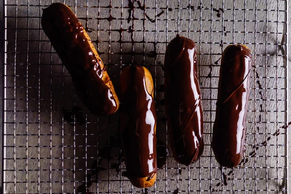 Tasty chocolate eclairs — Stock Photo, Image