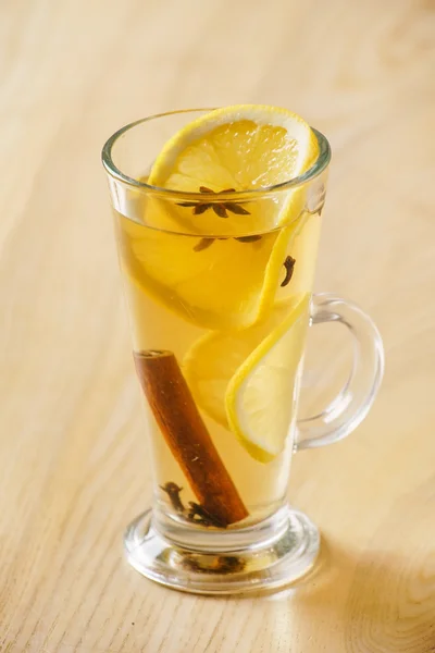 Winter drink with lemon and cinnamon — Stock Photo, Image