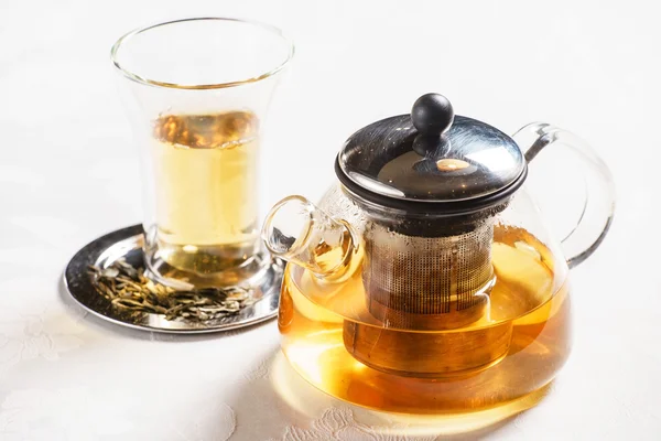 Teapot with tea and cup — Stock Photo, Image