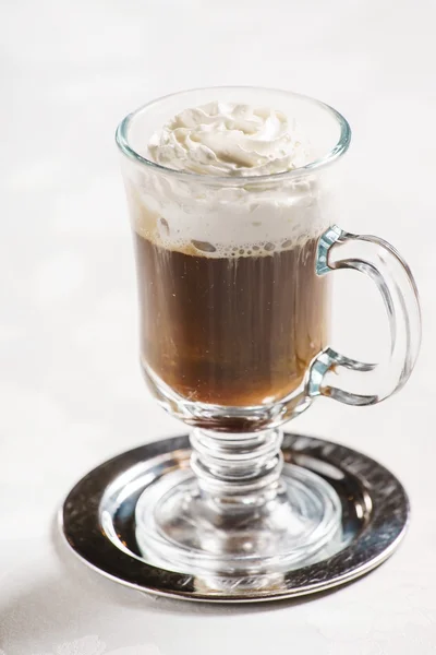 Glass of coffee with whipped cream — Stock Photo, Image