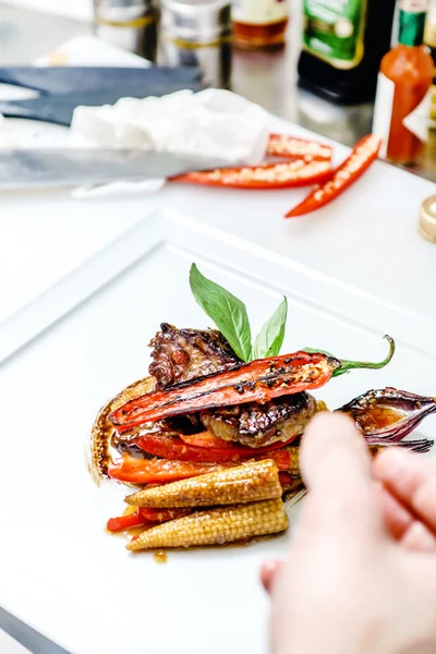 Chef cooking steak — Stock Photo, Image