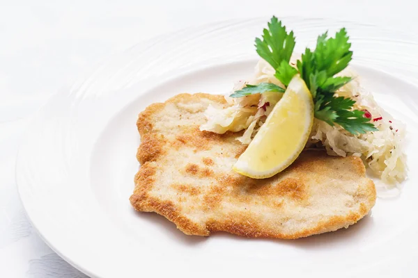 Schnitzel with cabbage on plate — Stock Photo, Image
