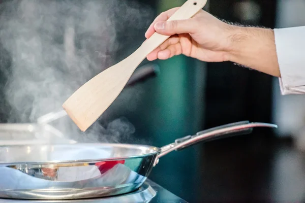 Chef cooking  with pan — Stock Photo, Image