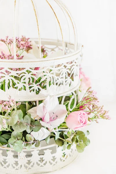 Romantic bouquet in cage — Stock Photo, Image