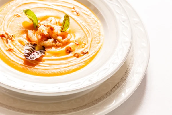 Pumpkin cream soup with shrimps — Stock Image Pumpkin cream soup with shrimps Royalty Free Stock Photos