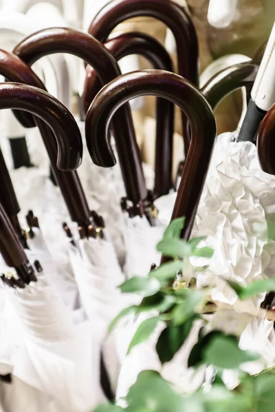 White umbrellas with handles — Stock Photo, Image