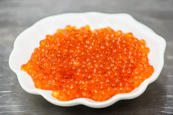 Red caviar in white plate — Stock Photo, Image