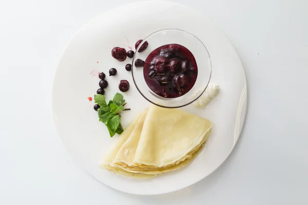 Tasty pancakes with sweet berry jam — Stock Photo, Image