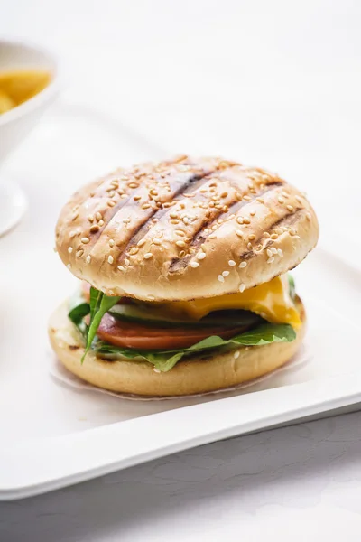 Tasty cheeseburger with potato — Stock Photo, Image