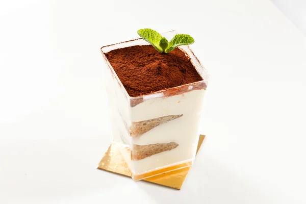 Tiramisu on golden plate — Stock Photo, Image