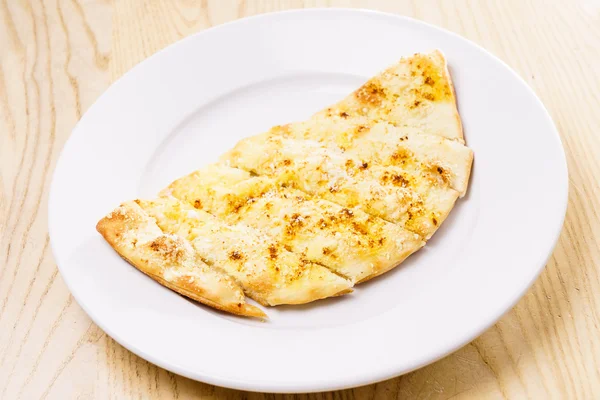 Tasty sliced focaccia with cheese — Stock Photo, Image