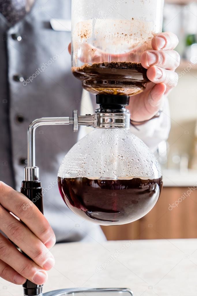 Male barista making coffee