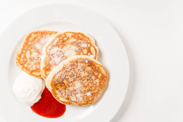 Tasty pancakes with sour cream — Stock Photo, Image