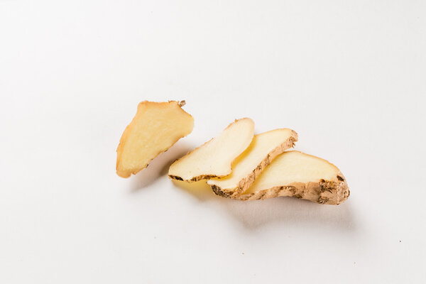 sliced ginger  on white