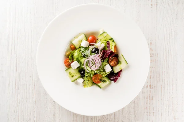 Greek salad on plate — Stock Photo, Image