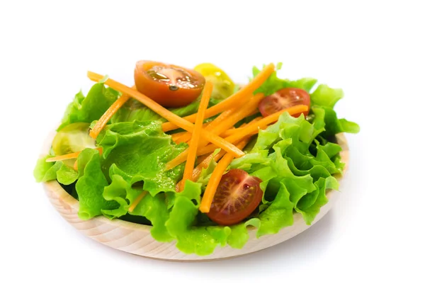 Fresh salad in a wooden plate — Stock Photo, Image